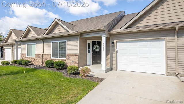 2489 Hatchery Crossing Dr, Waterford, MI 48329 - view of front facade featuring a garage, brick siding, a front lawn, driveway, and roof with shingles
