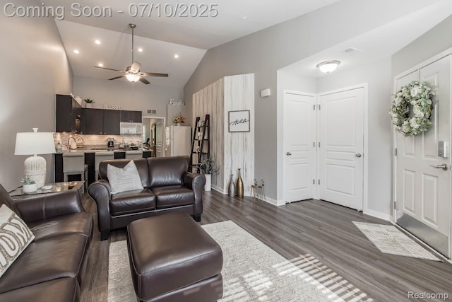 2489 Hatchery Crossing Dr, Waterford, MI 48329 - living room with dark wood-style flooring, ceiling fan, vaulted ceiling, and recessed lighting