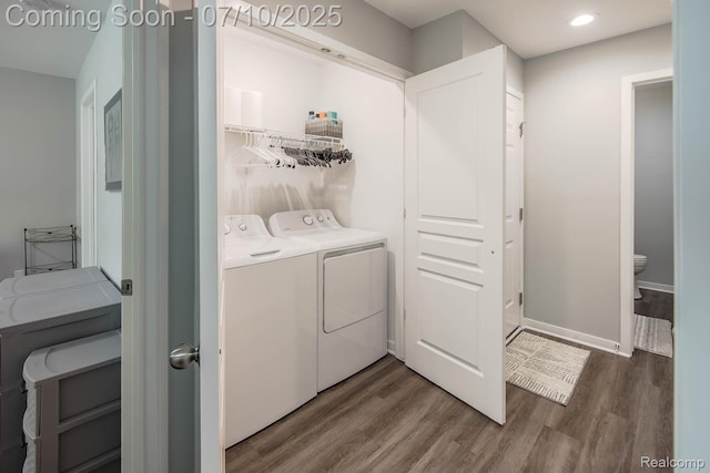 2489 Hatchery Crossing Dr, Waterford, MI 48329 - laundry room featuring independent washer and dryer, wood finished floors, and recessed lighting