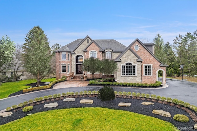 18198 Shelley Pond, Northville, MI 48168 - french country home featuring stone siding and a front yard
