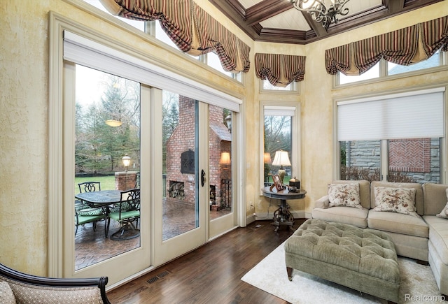 18198 Shelley Pond, Northville, MI 48168 - sunroom with coffered ceiling, a chandelier, healthy amount of natural light, beam ceiling, and wood finished floors