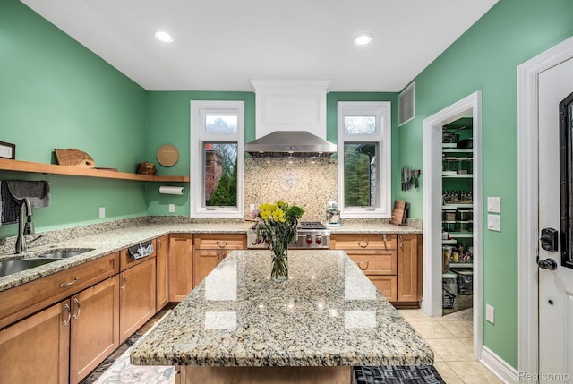 18198 Shelley Pond, Northville, MI 48168 - kitchen with open shelves, light stone counters, plenty of natural light, range, and recessed lighting