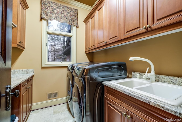 18198 Shelley Pond, Northville, MI 48168 - laundry room with cabinet space, washer and dryer, and ornamental molding