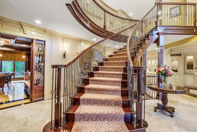 18198 Shelley Pond, Northville, MI 48168 - stairway with a decorative wall, a towering ceiling, crown molding, and recessed lighting