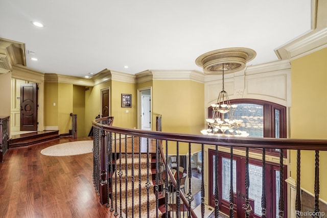 18198 Shelley Pond, Northville, MI 48168 - corridor featuring a chandelier, wood finished floors, crown molding, recessed lighting, and an upstairs landing