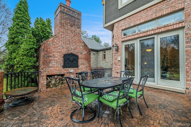 18198 Shelley Pond, Northville, MI 48168 - view of patio featuring a brick fireplace and outdoor dining area