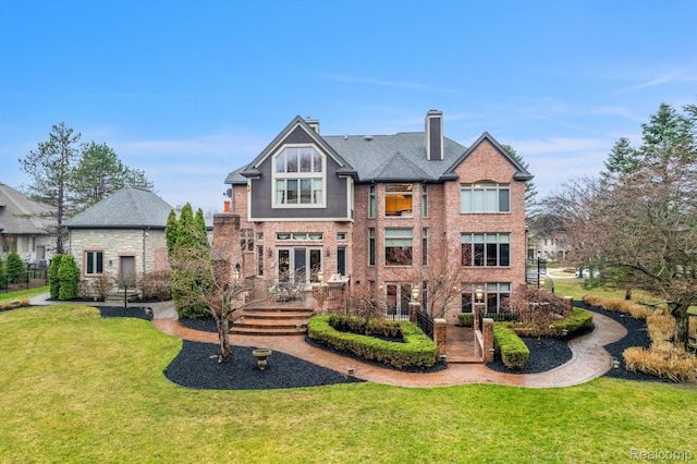 18198 Shelley Pond, Northville, MI 48168 - back of property featuring a lawn, brick siding, and a chimney