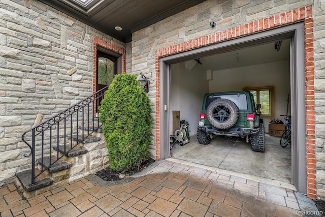 18198 Shelley Pond, Northville, MI 48168 - entrance to property featuring stone siding and a garage