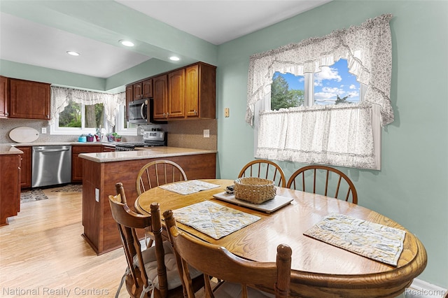 1306 Bishops Ter, Wixom, MI 48393 - dining area with light wood finished floors and recessed lighting