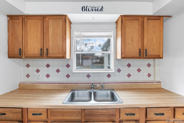 322 Michelson Rd, Rochester Hills, MI 48307 - kitchen with light countertops, backsplash, and brown cabinets