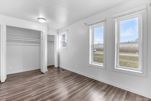 322 Michelson Rd, Rochester Hills, MI 48307 - unfurnished bedroom with wood finished floors and a closet