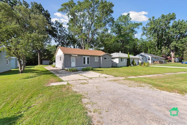 322 Michelson Rd, Rochester Hills, MI 48307 - ranch-style house with a front lawn and driveway