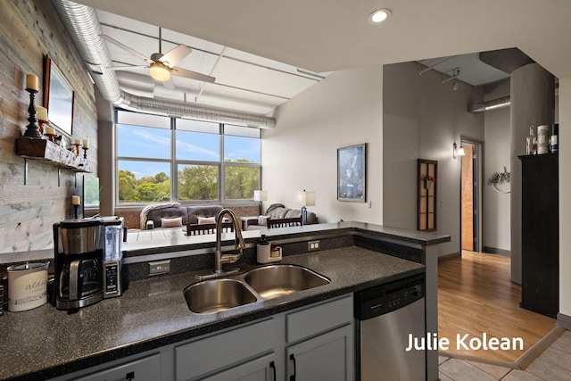 930 Washington Ave Unit 5C, Muskegon, MI 49441 - kitchen with stainless steel dishwasher, dark countertops, a ceiling fan, light tile patterned floors, and recessed lighting