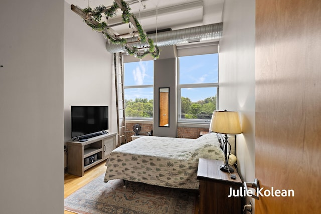 930 Washington Ave Unit 5C, Muskegon, MI 49441 - bedroom featuring wood finished floors