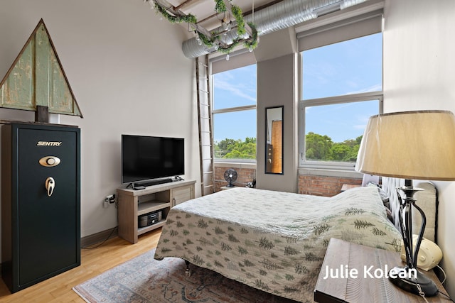 930 Washington Ave Unit 5C, Muskegon, MI 49441 - bedroom with light wood-style flooring