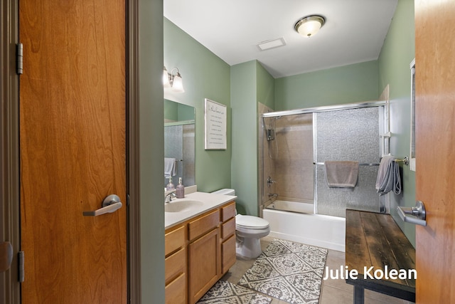 930 Washington Ave Unit 5C, Muskegon, MI 49441 - full bathroom with vanity, combined bath / shower with glass door, and tile patterned floors