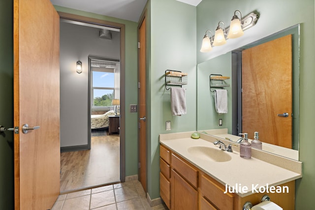 930 Washington Ave Unit 5C, Muskegon, MI 49441 - bathroom with vanity, tile patterned floors, and ensuite bath