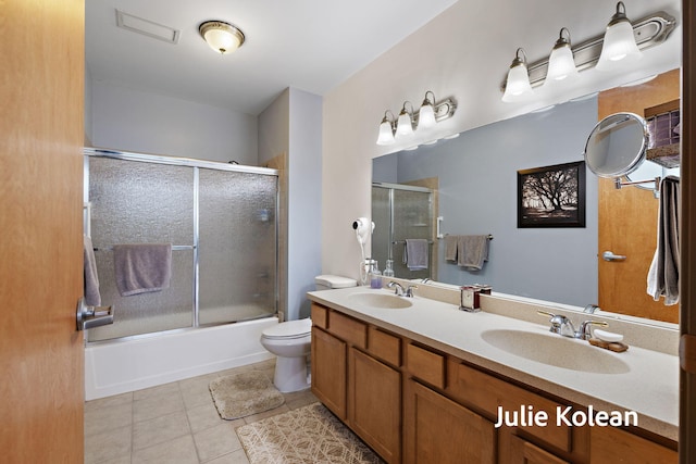 930 Washington Ave Unit 5C, Muskegon, MI 49441 - full bath with tile patterned flooring, shower / bath combination with glass door, and double vanity