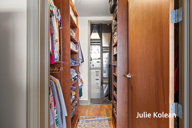 930 Washington Ave Unit 5C, Muskegon, MI 49441 - walk in closet featuring wood finished floors