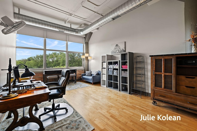 930 Washington Ave Unit 5C, Muskegon, MI 49441 - office featuring a high ceiling and wood finished floors