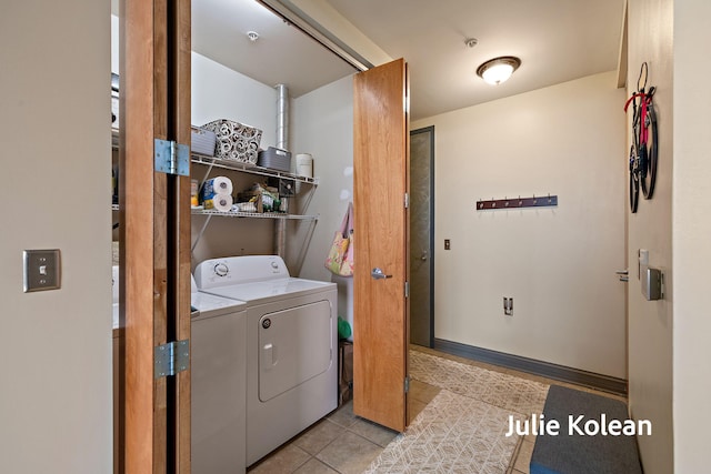 930 Washington Ave Unit 5C, Muskegon, MI 49441 - washroom featuring washer and dryer and tile patterned floors