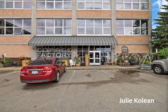 930 Washington Ave Unit 5C, Muskegon, MI 49441 - view of commercial property featuring uncovered parking