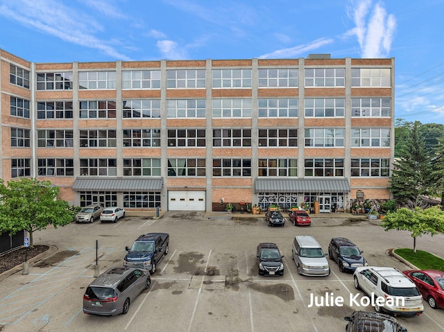 930 Washington Ave Unit 5C, Muskegon, MI 49441 - view of property featuring uncovered parking