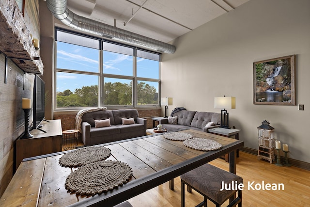 930 Washington Ave Unit 5C, Muskegon, MI 49441 - living area with wood finished floors and a high ceiling