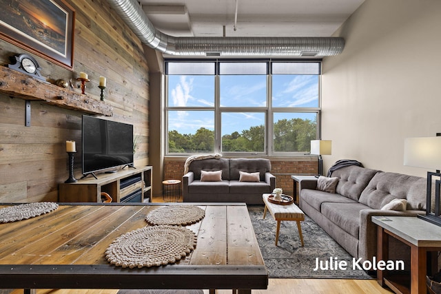 930 Washington Ave Unit 5C, Muskegon, MI 49441 - living area featuring wood walls and wood finished floors