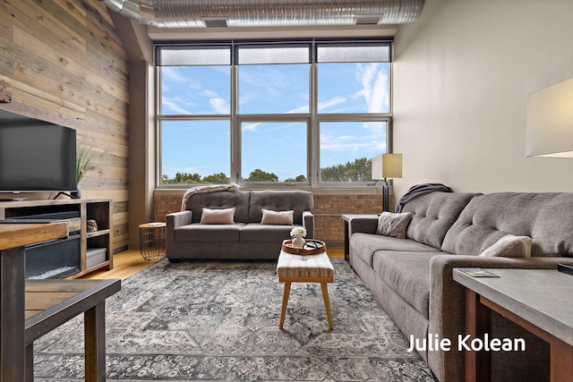930 Washington Ave Unit 5C, Muskegon, MI 49441 - living room with wood finished floors and wood walls
