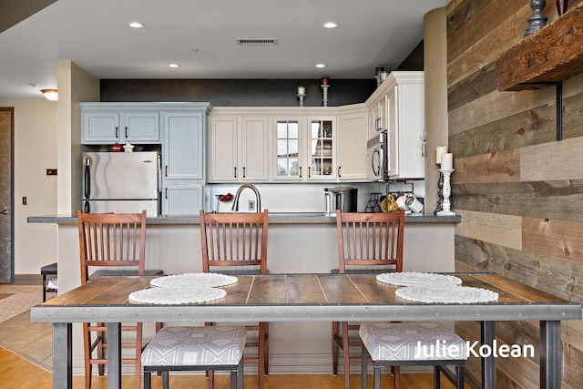 930 Washington Ave Unit 5C, Muskegon, MI 49441 - dining area with recessed lighting and light wood finished floors