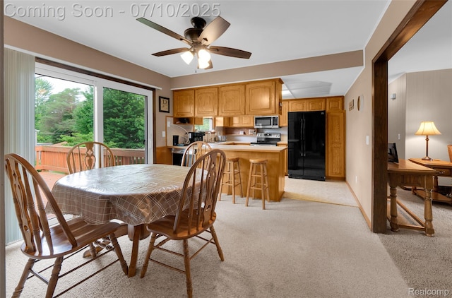 2150 Dunwoodie St, Ortonville, MI 48462 - dining room featuring light carpet and a ceiling fan