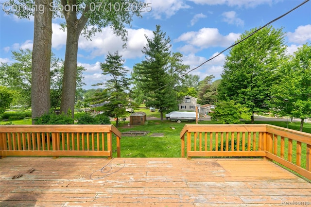 2150 Dunwoodie St, Ortonville, MI 48462 - wooden terrace featuring a lawn