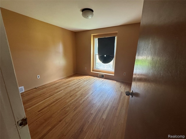 28330 Lahser Rd, Southfield, MI 48034 - empty room with wood finished floors and baseboards