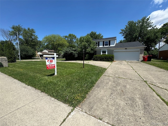 28330 Lahser Rd, Southfield, MI 48034 - view of front facade featuring a garage, driveway, and a front lawn