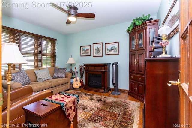 6626 Lake Pointe, Shelby Twp, MI 48317 - living area with a fireplace, wood finished floors, and ceiling fan