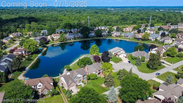 6626 Lake Pointe, Shelby Twp, MI 48317 - aerial view of residential area featuring a large body of water and a heavily wooded area