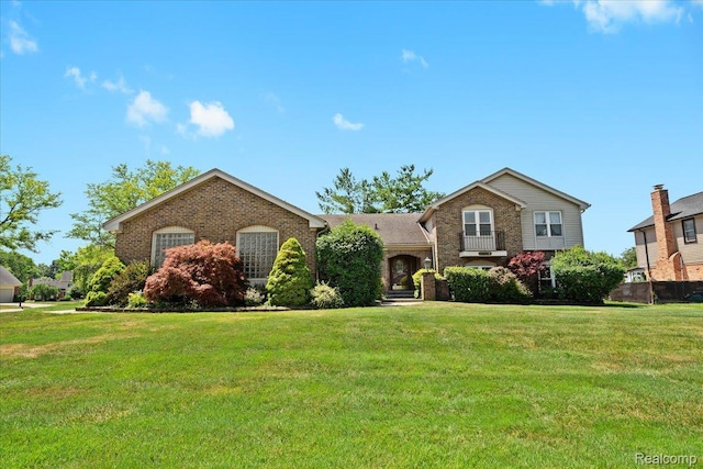 20213 Whitby Dr, Livonia, MI 48152 - tri-level home with brick siding and a front lawn