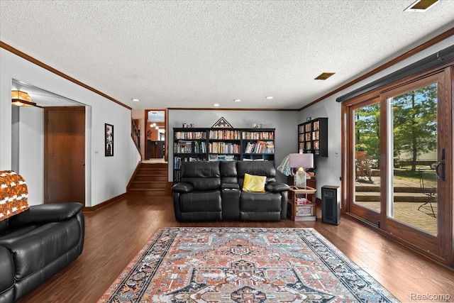 20213 Whitby Dr, Livonia, MI 48152 - living room with ornamental molding, a textured ceiling, wood finished floors, and stairs