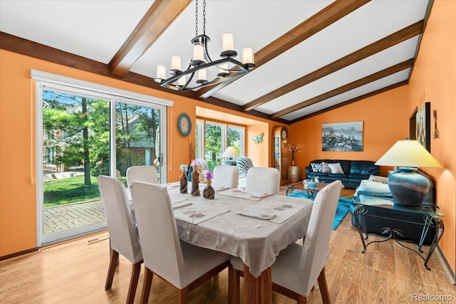 20213 Whitby Dr, Livonia, MI 48152 - dining space with a chandelier and light wood-style flooring