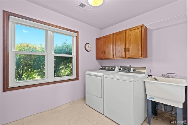 20213 Whitby Dr, Livonia, MI 48152 - washroom featuring cabinet space and separate washer and dryer