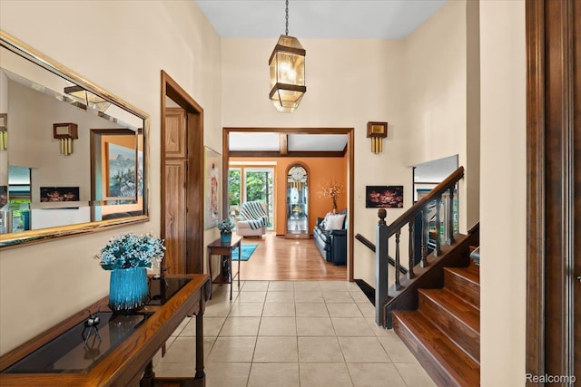 20213 Whitby Dr, Livonia, MI 48152 - foyer with stairway, light tile patterned floors, and a towering ceiling