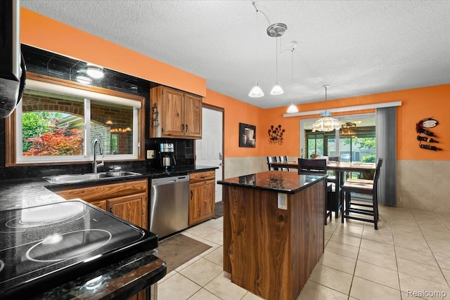 20213 Whitby Dr, Livonia, MI 48152 - kitchen with dishwasher, a kitchen island, black range with electric cooktop, a chandelier, and a textured ceiling