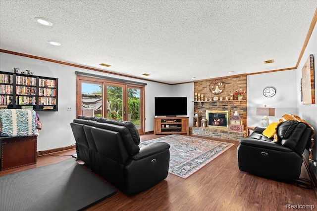 20213 Whitby Dr, Livonia, MI 48152 - living room featuring ornamental molding, a textured ceiling, wood finished floors, and a fireplace