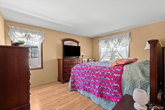 20213 Whitby Dr, Livonia, MI 48152 - bedroom featuring light wood-type flooring and baseboards