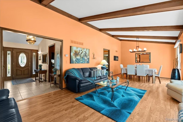 20213 Whitby Dr, Livonia, MI 48152 - living room with a chandelier, beamed ceiling, and wood finished floors