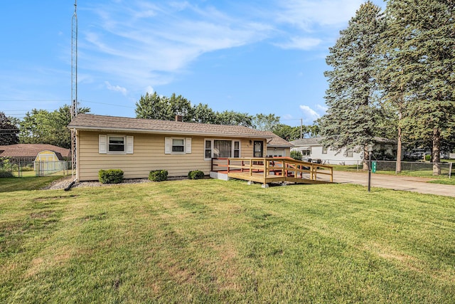 981 Vinewood Dr, Saint Joseph, MI 49085 - rear view of property featuring a deck and driveway