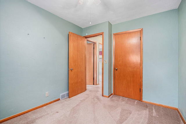 981 Vinewood Dr, Saint Joseph, MI 49085 - unfurnished bedroom featuring carpet flooring, a closet, and ceiling fan