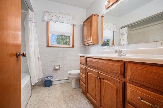 981 Vinewood Dr, Saint Joseph, MI 49085 - full bath featuring tile walls, vanity, healthy amount of natural light, shower / bath combo with shower curtain, and wainscoting