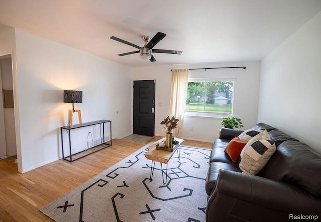 8220 Rivard Ave, Warren, MI 48089 - living area with ceiling fan and light wood-style flooring
